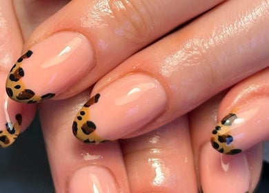 Elegant leopard print nails by By Paige in Urmston, England, GB. Perfect manicure close-up.