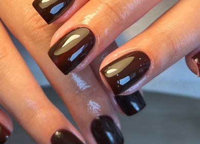 Elegant black nails with glossy finish by Paige in Urmston, England, GB.