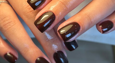 Elegant black nails with glossy finish by Paige in Urmston, England, GB.