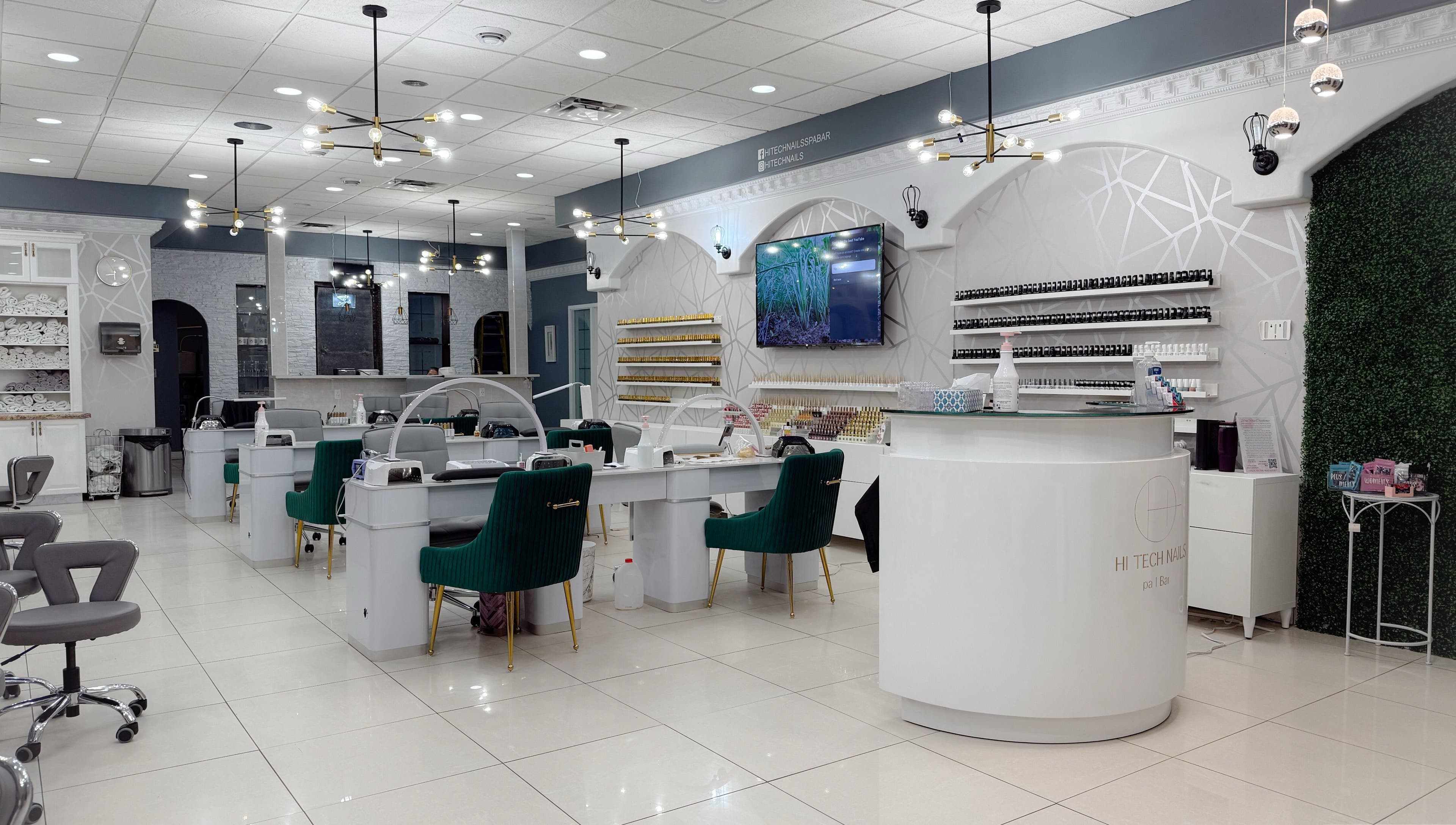 Elegant interior of Hi-Tech Nails & Spa in St. Albert, Alberta, CA, featuring modern nail stations and decor.