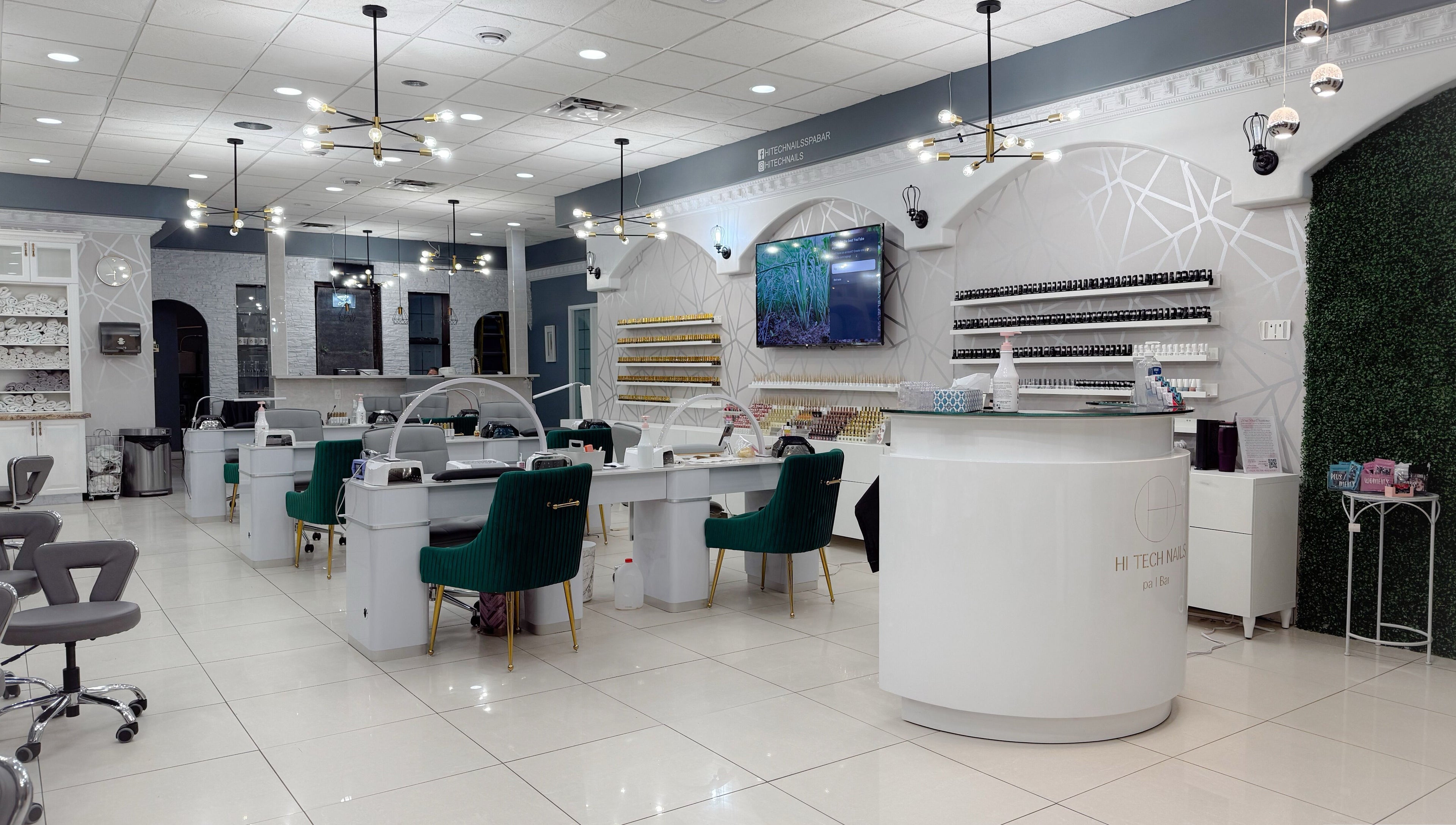 Elegant interior of Hi-Tech Nails & Spa in St. Albert, Alberta, CA, featuring modern nail stations and decor.