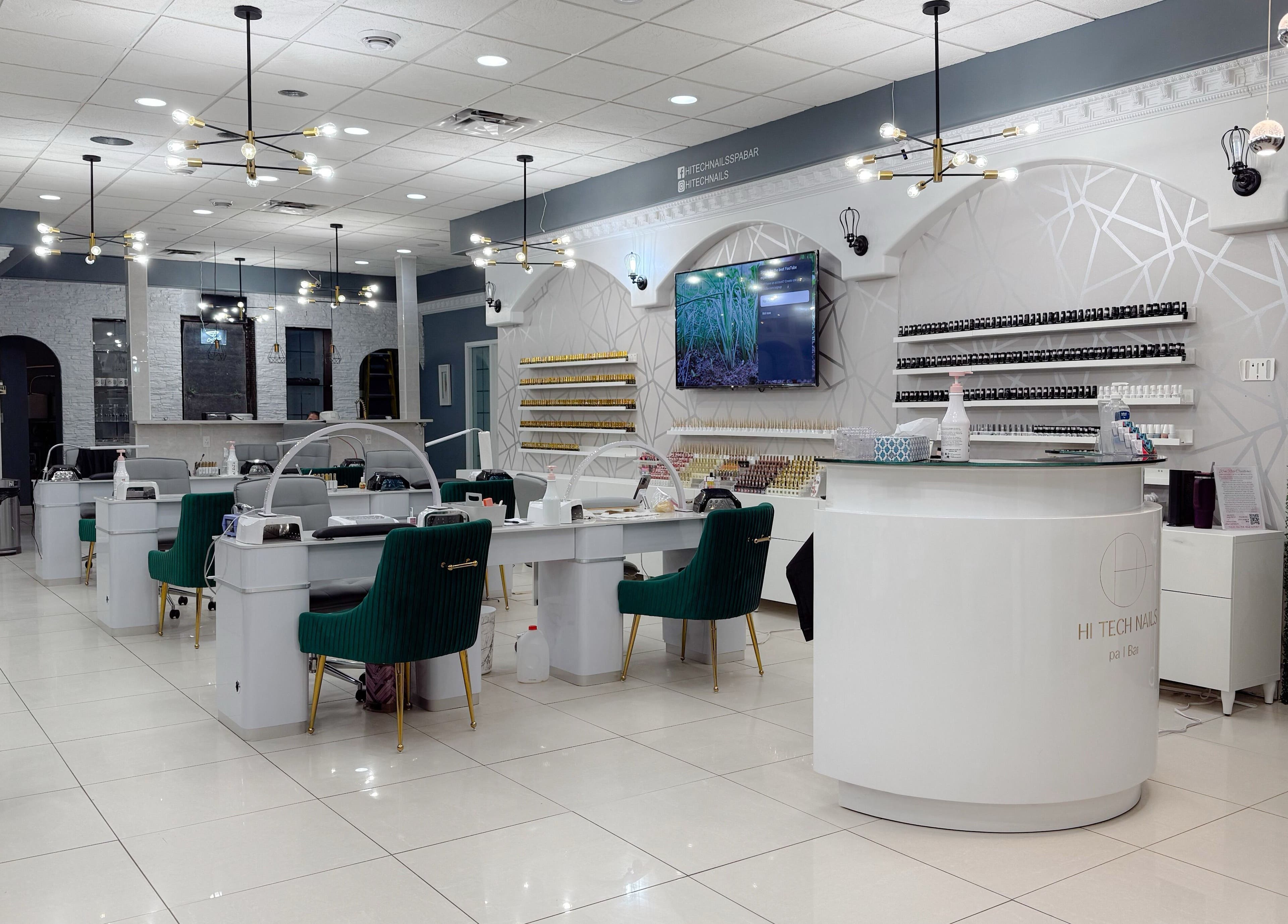 Elegant interior of Hi-Tech Nails & Spa in St. Albert, Alberta, CA, featuring modern nail stations and decor.