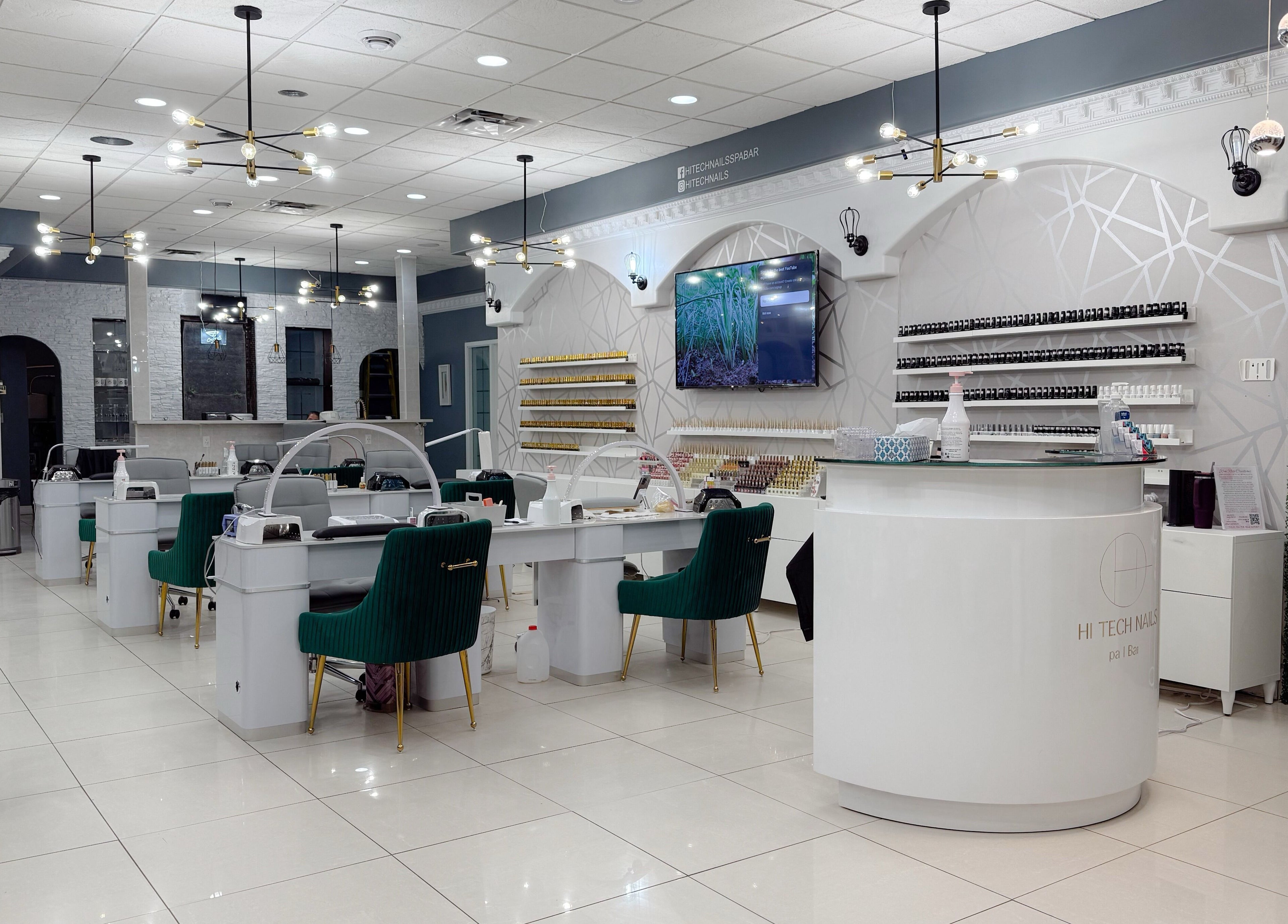 Elegant interior of Hi-Tech Nails & Spa in St. Albert, Alberta, CA, featuring modern nail stations and decor.