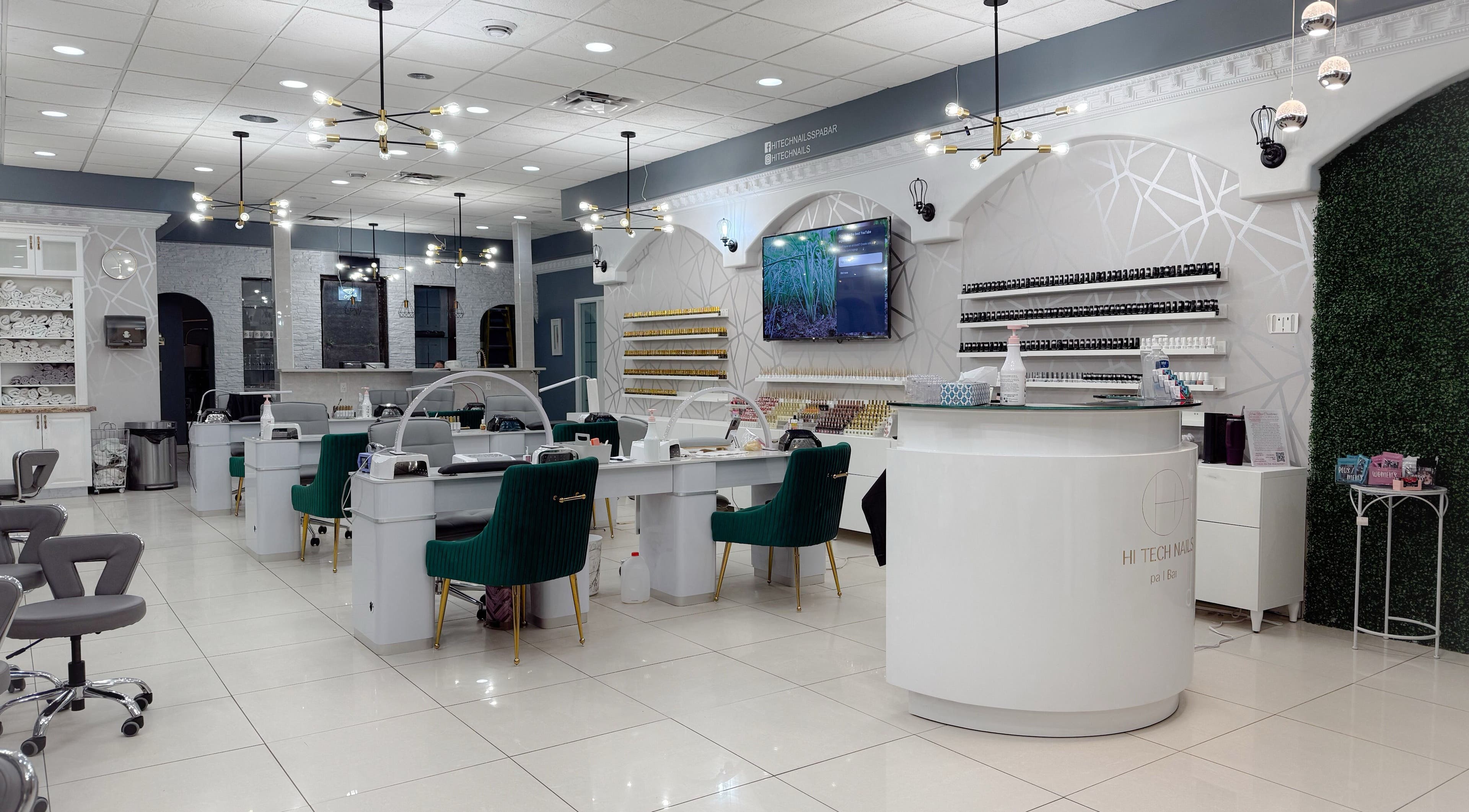 Elegant interior of Hi-Tech Nails & Spa in St. Albert, Alberta, CA, featuring modern nail stations and decor.