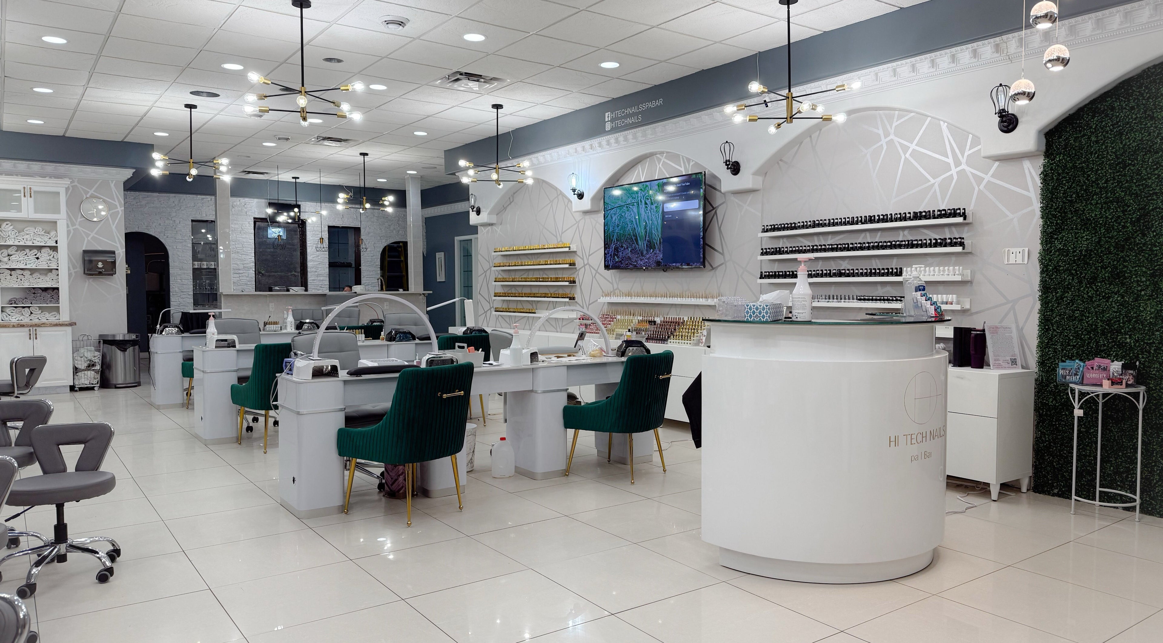 Elegant interior of Hi-Tech Nails & Spa in St. Albert, Alberta, CA, featuring modern nail stations and decor.