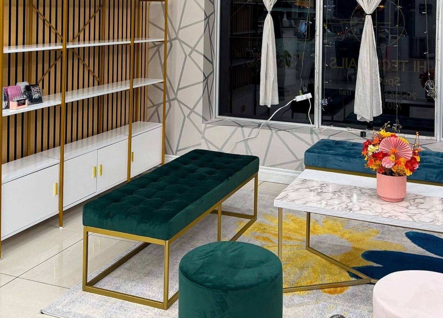 Stylish lounge area at Hi-Tech Nails & Spa, St. Albert, Alberta, CA with plush seating and modern decor.