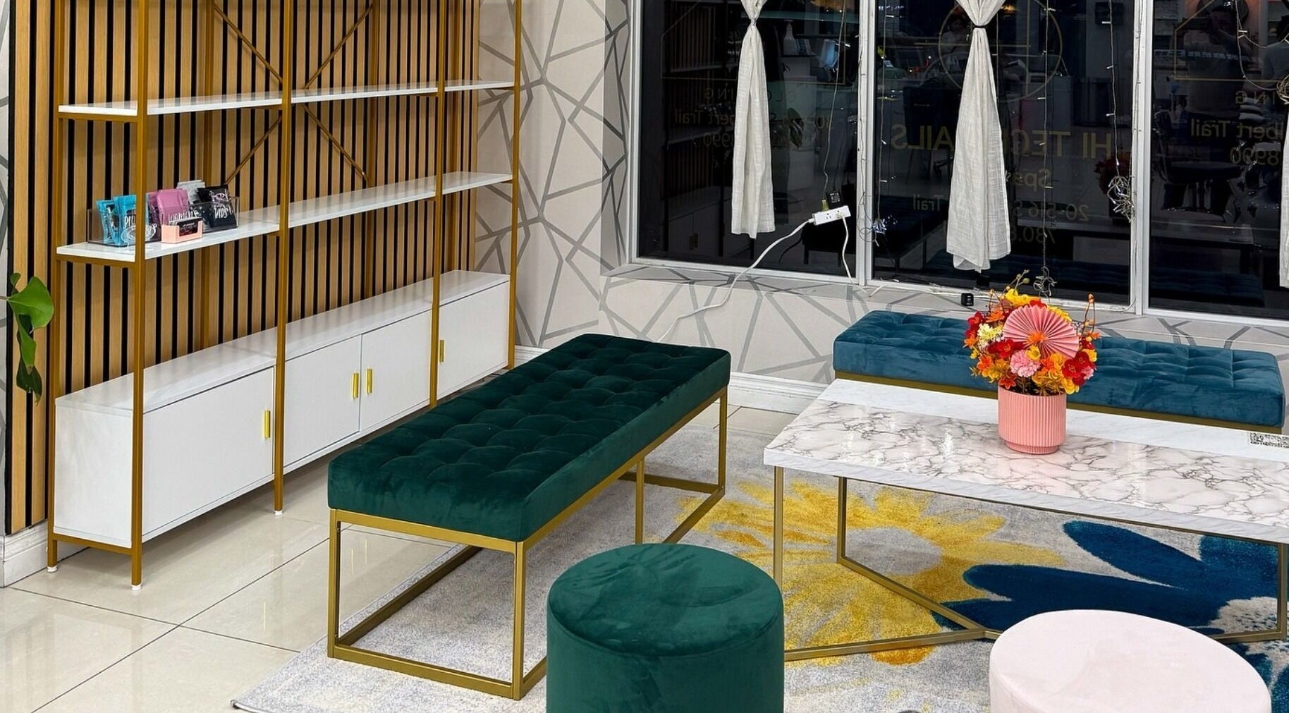 Stylish lounge area at Hi-Tech Nails & Spa, St. Albert, Alberta, CA with plush seating and modern decor.