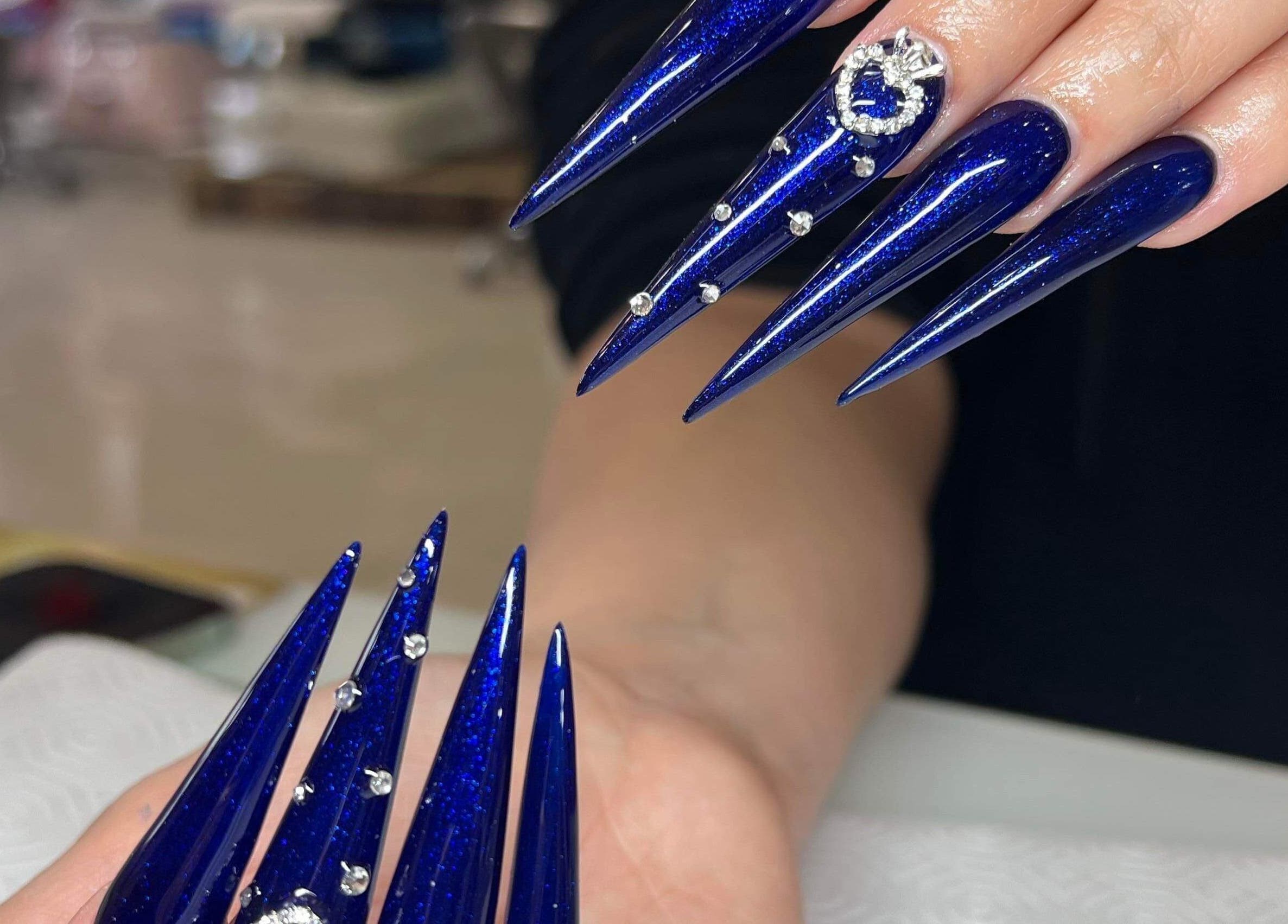 Elegant blue nails with rhinestone accents at Hi-Tech Nails & Spa, St. Albert, Alberta, CA.