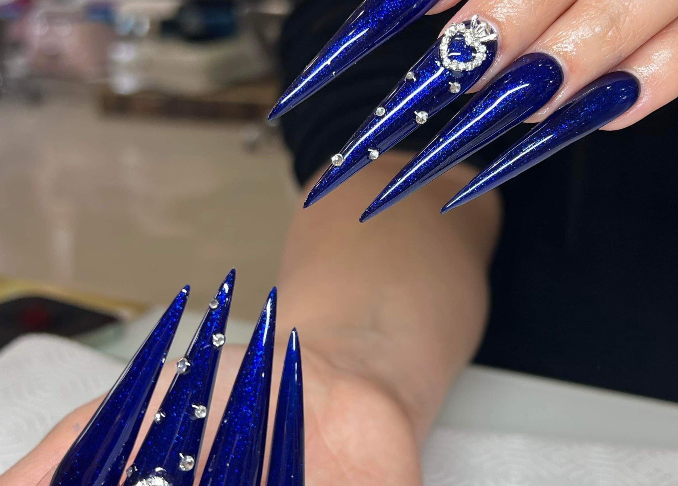 Elegant blue nails with rhinestone accents at Hi-Tech Nails & Spa, St. Albert, Alberta, CA.