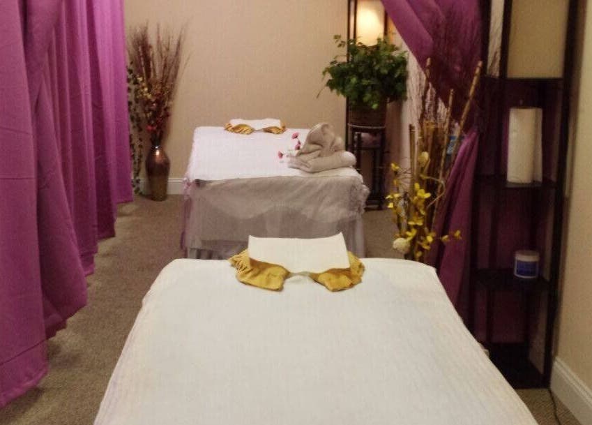 Relaxing massage room at Oba Massage, Jacksonville, Florida, US, with neatly arranged beds and calming decor.
