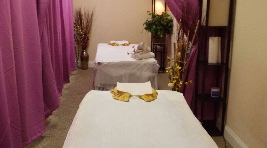 Relaxing massage room at Oba Massage, Jacksonville, Florida, US, with neatly arranged beds and calming decor.