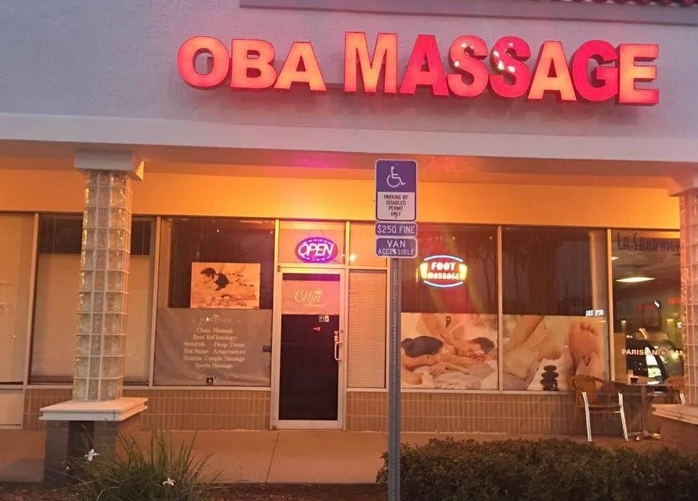 Front view of Oba Massage in Jacksonville, Florida, US with bright signage and welcoming ambiance.