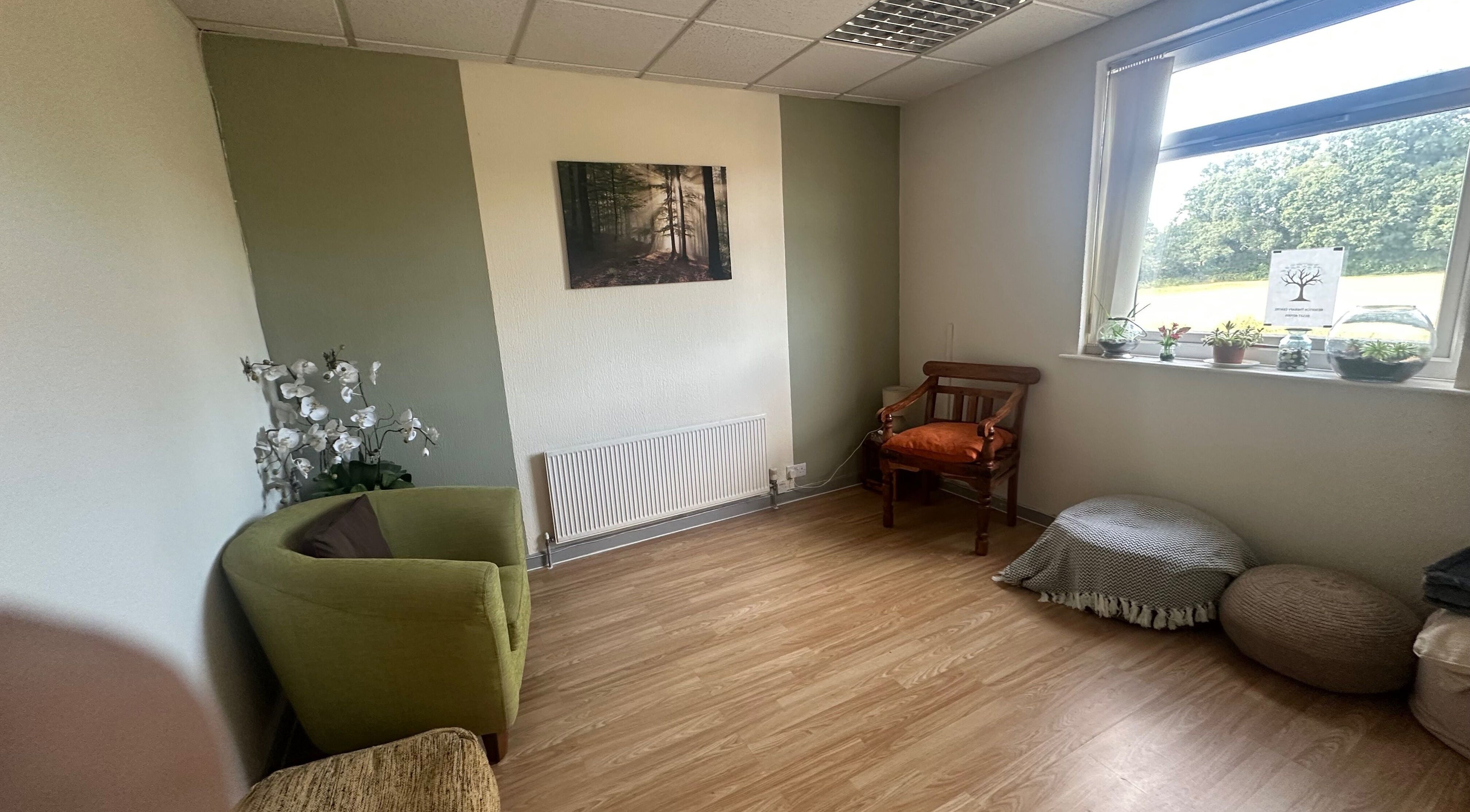Relaxing therapy room at Redditch Therapy Centre, Redditch, England, GB, with comfy chairs and serene decor.