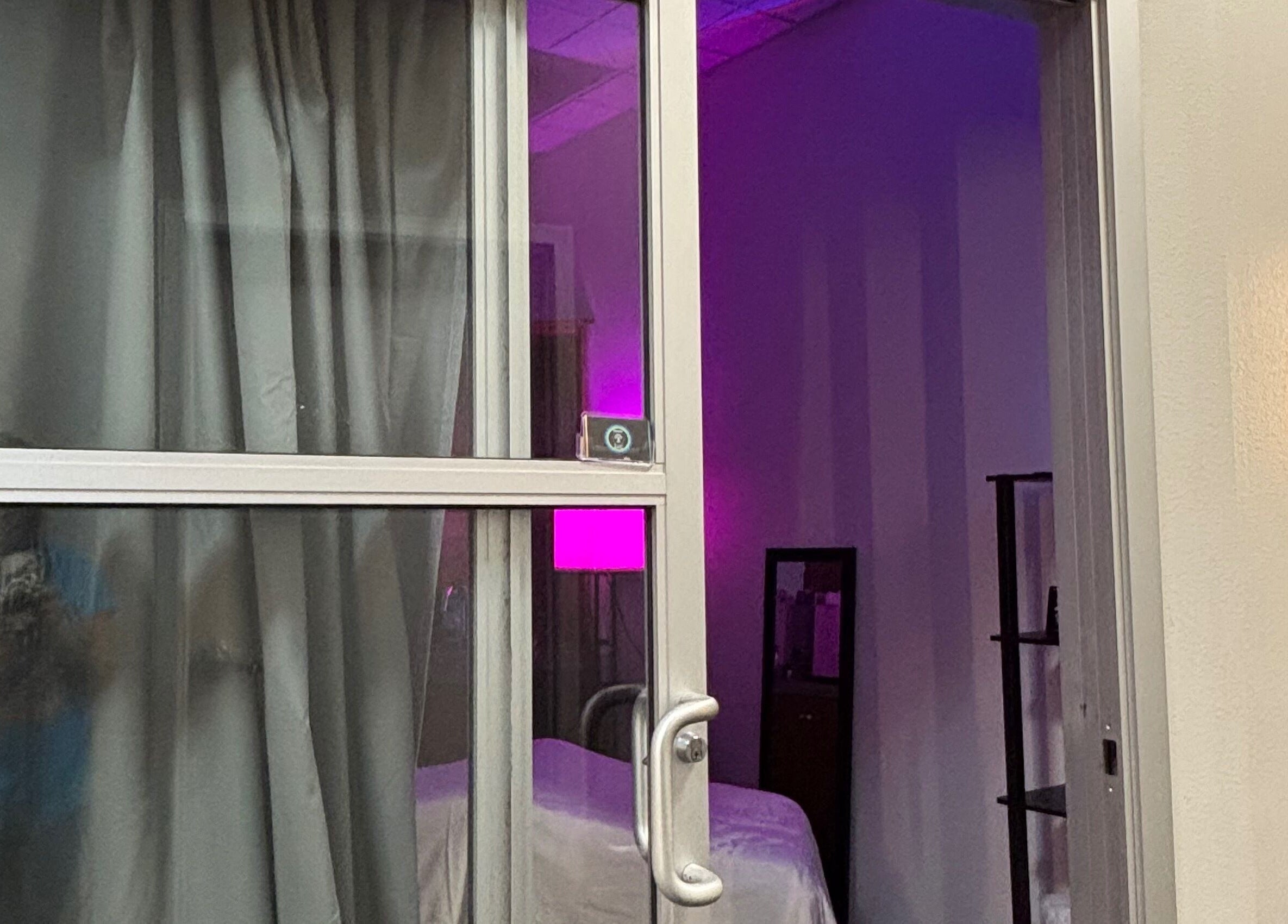 Entrance to Moore Magic Massage in North Little Rock, Arkansas, featuring a softly lit massage room.