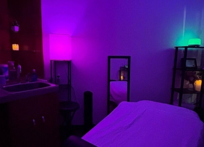 Relaxing massage room with ambient lighting at Moore Magic Massage, North Little Rock, Arkansas, US.
