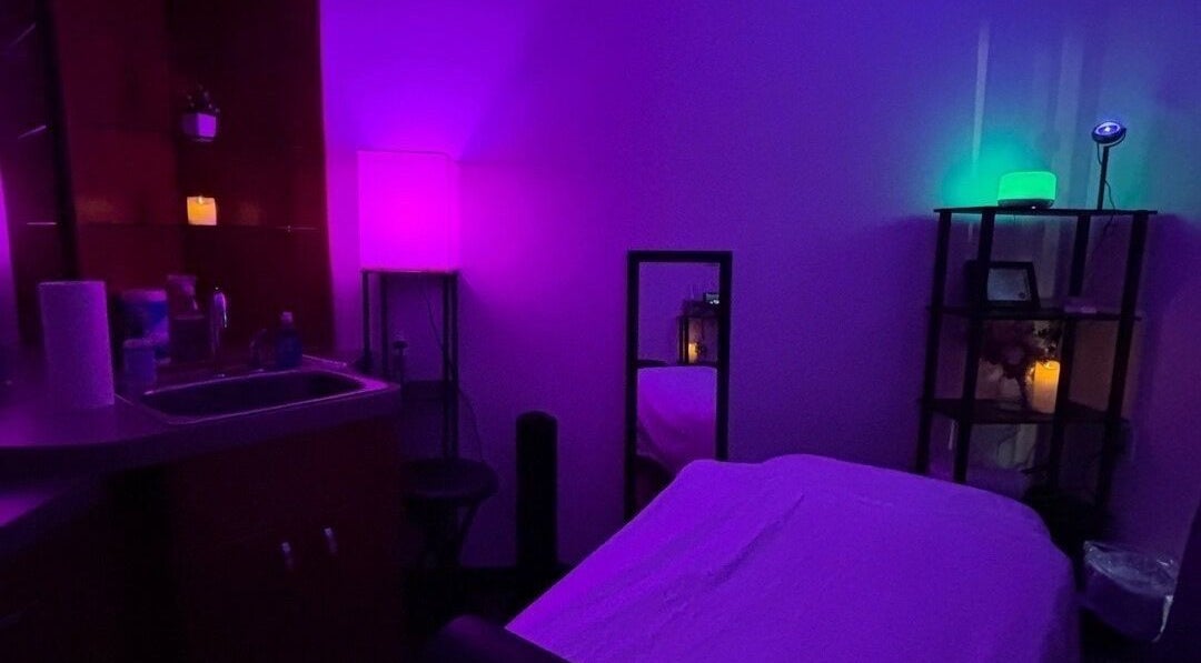 Relaxing massage room with ambient lighting at Moore Magic Massage, North Little Rock, Arkansas, US.