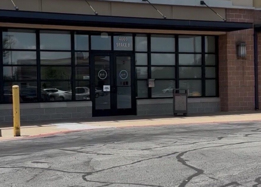 Street view of Moore Magic Massage entrance in North Little Rock, Arkansas, US, showcasing modern design.