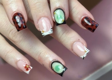 Close-up of creative nail art at The Nail Lounge, Barnsley, England, GB featuring unique designs.