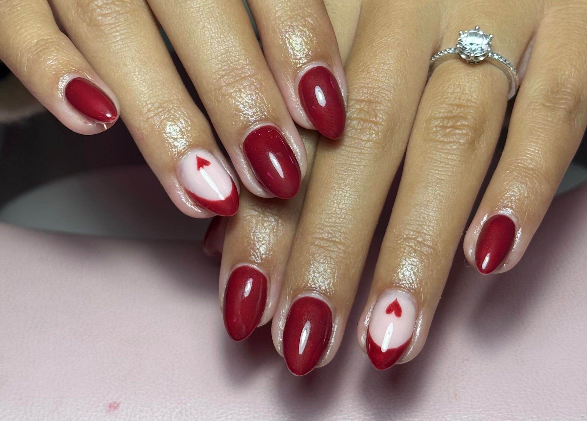 Red heart nail art at The Nail Lounge, Barnsley, England, GB showcasing elegant manicure.