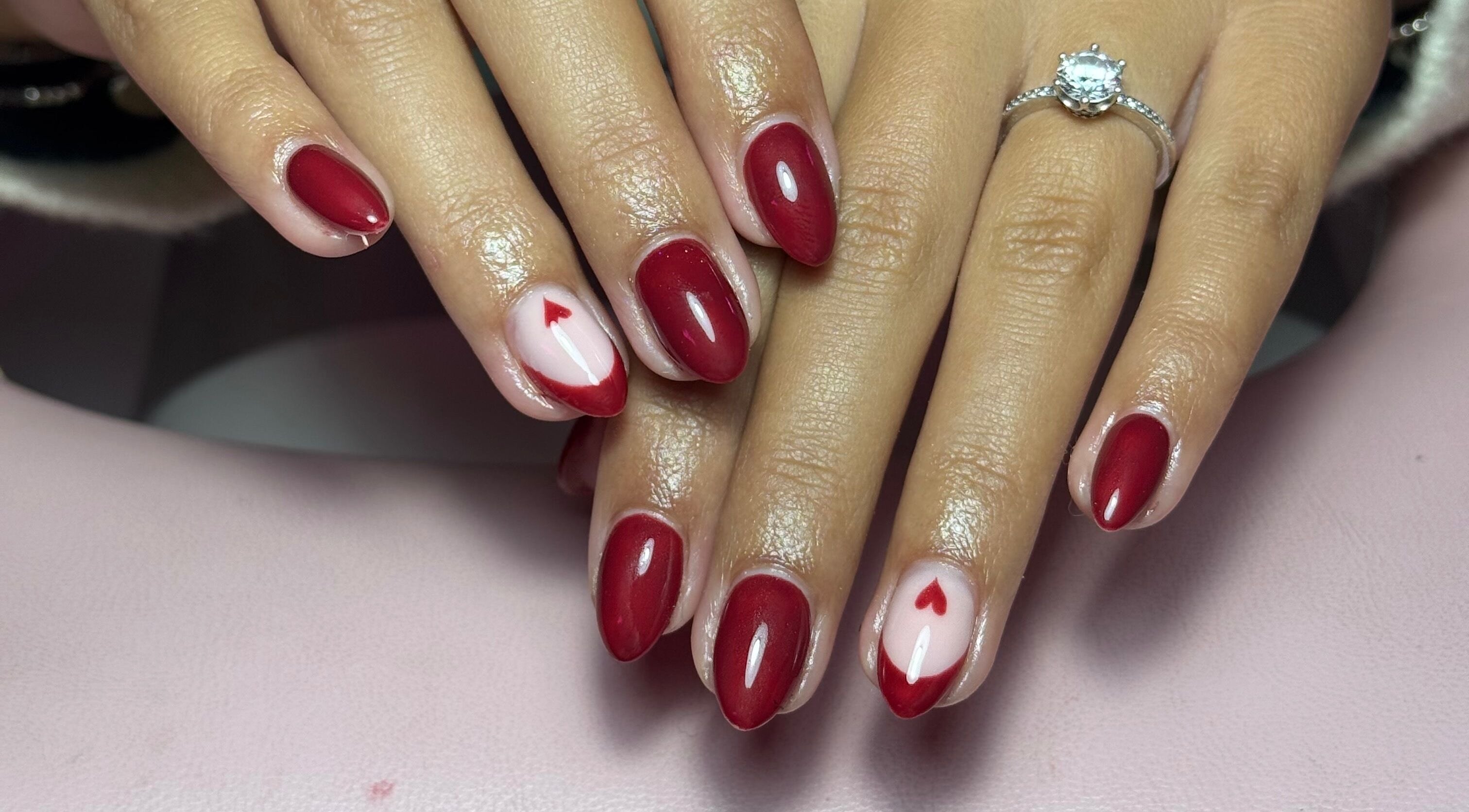 Red heart nail art at The Nail Lounge, Barnsley, England, GB showcasing elegant manicure.