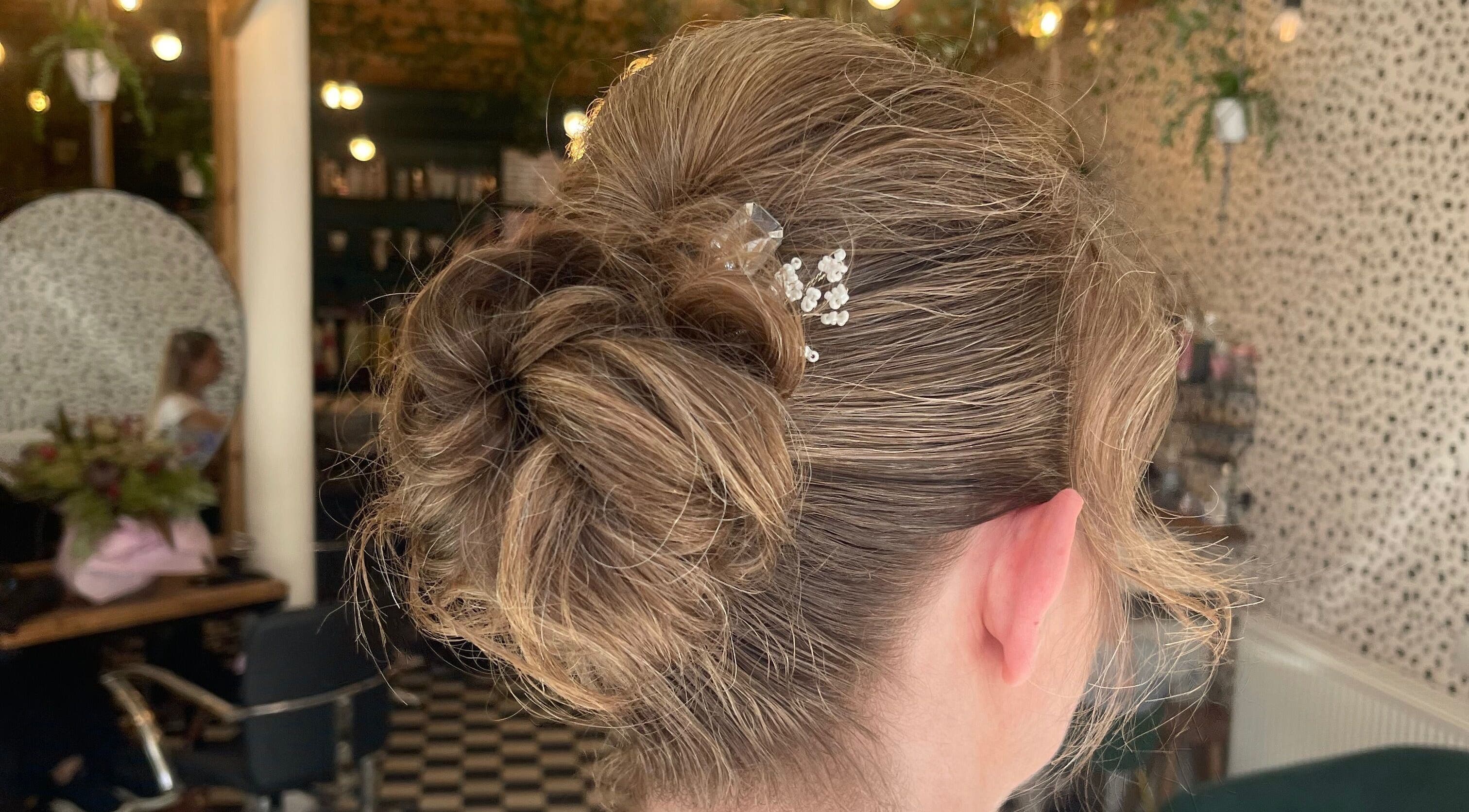 Intricate hair updo with delicate floral clip at Weronika studio, Elgin, Scotland, GB.