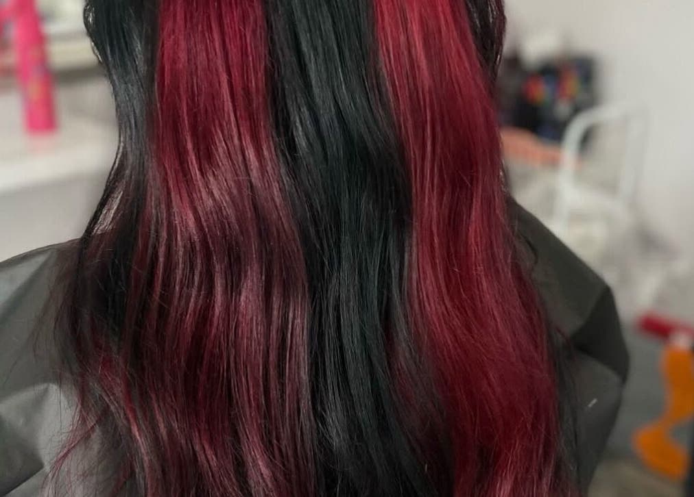 Stunning red and black hair design at Weronika studio, Elgin, Scotland, GB, showcasing vibrant color blending.