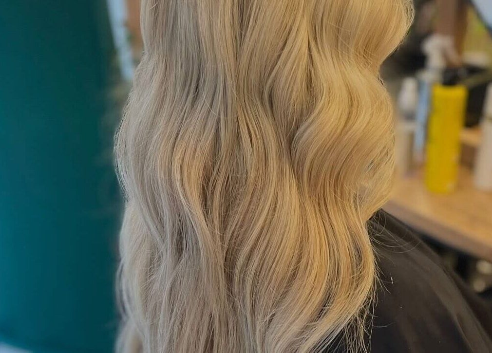 Blonde wavy hairstyle at Weronika Studio, Elgin, Scotland, GB showcasing elegant hair artistry.