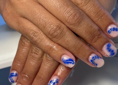 Elegant blue nail design at The Nail Room, Cliffsend, England, GB, showcasing intricate artistry.