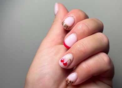 Cherry nail art at The Nail Room, Cliffsend, England, GB, showcasing creative manicure design.