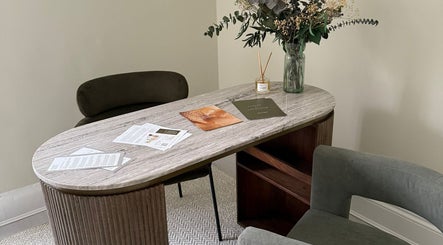 Serene office space at Synergistic Therapy, Birmingham, England with elegant decor and floral arrangement.