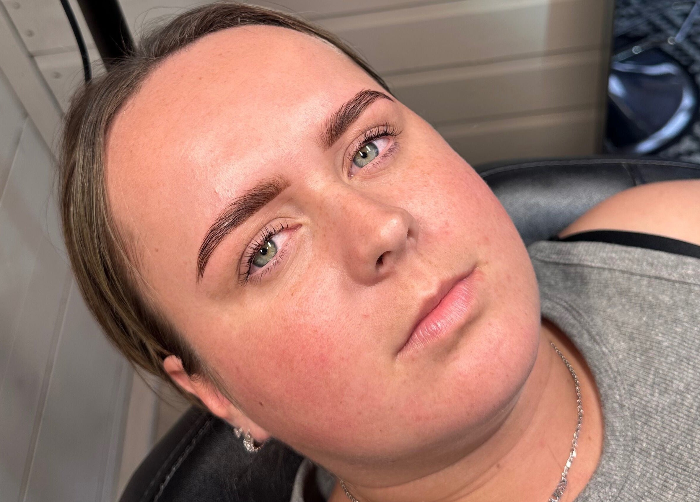 Woman with perfectly shaped eyebrows at Bespoke By Sommer, Armadale, Scotland, GB.