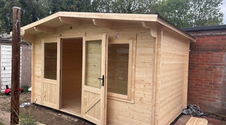 Amore Lashes cozy wooden cabin exterior in Harston, England, GB, welcoming relaxation and beauty services.