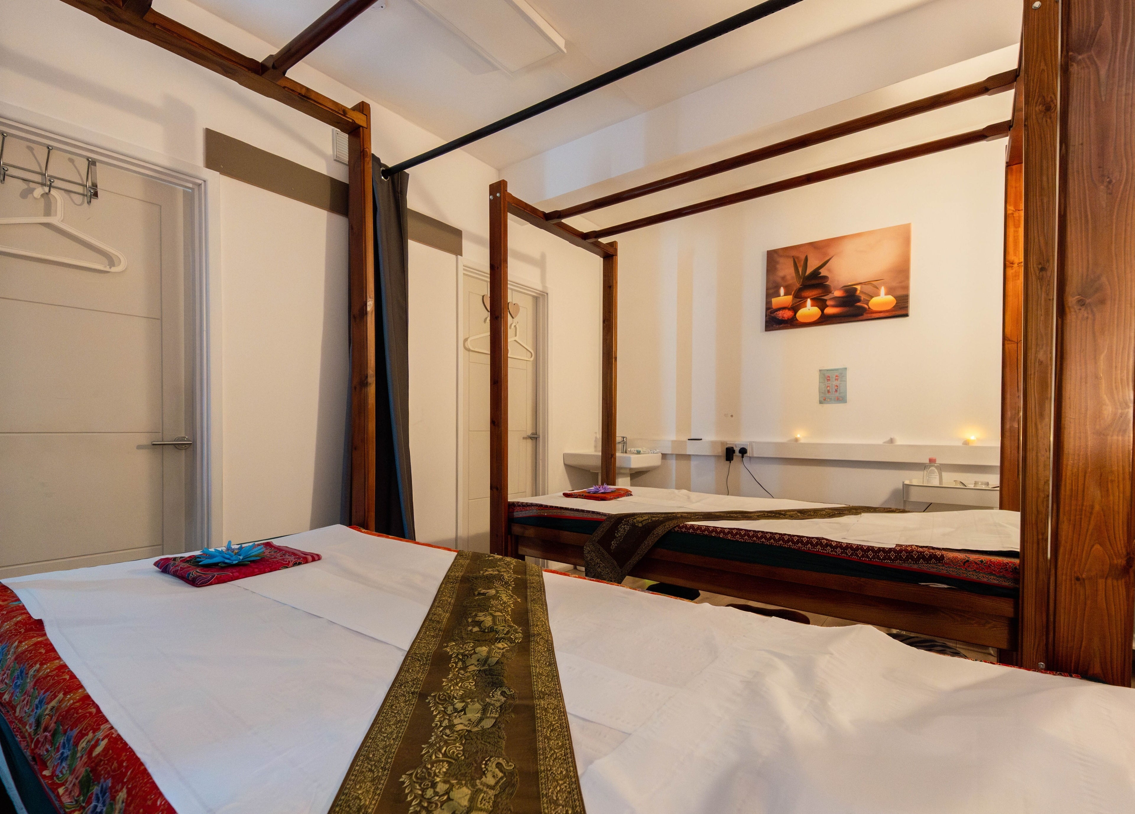 Relaxing massage room at Somchit Thai Massage and Spa in London, England, GB with elegant decor.