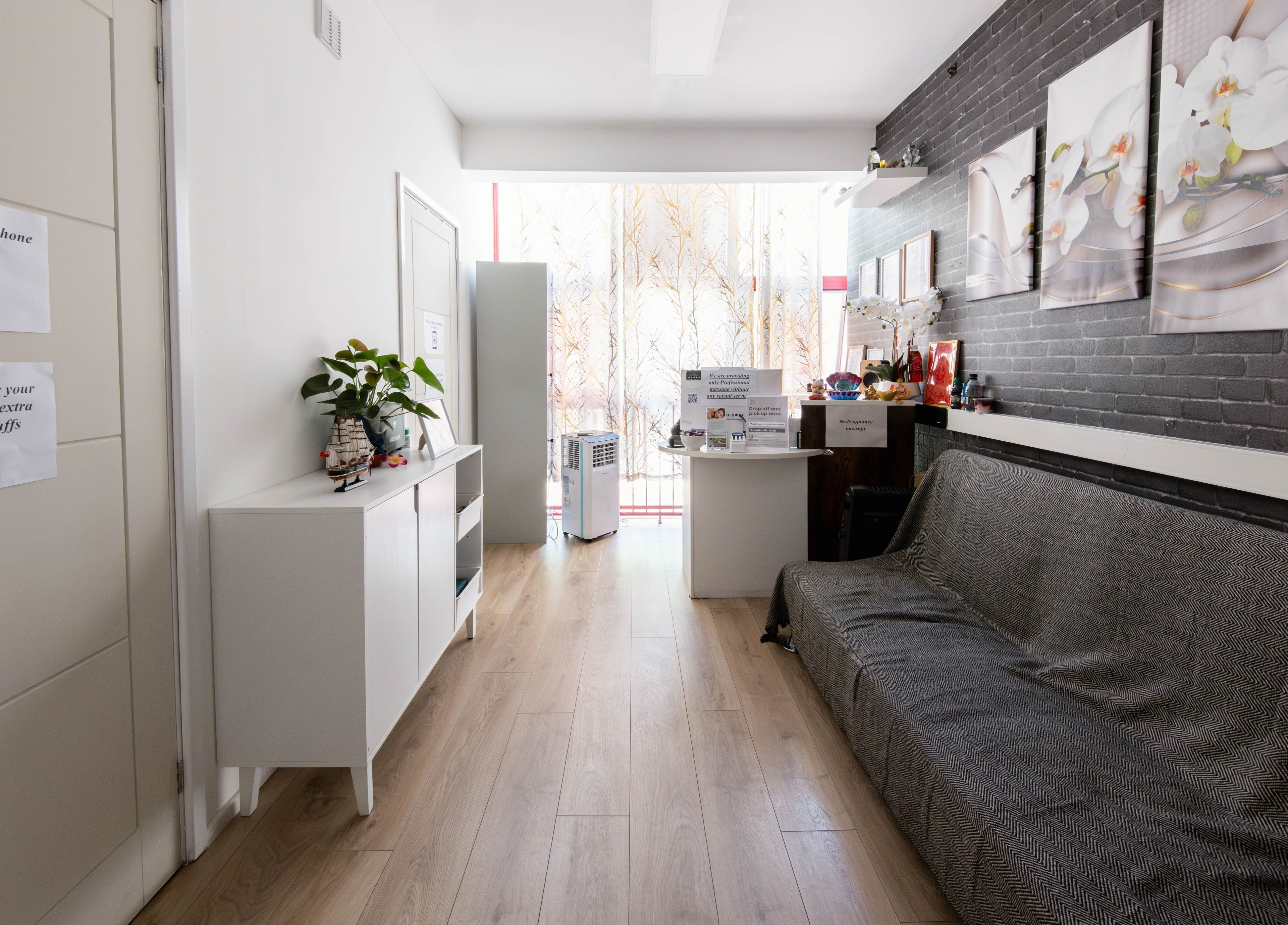 Reception area of Somchit Thai Massage and Spa in London, England, GB featuring elegant decor and comfortable seating.