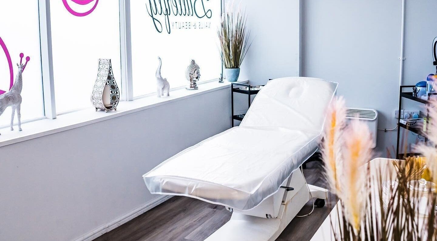 Treatment room at Butterfly Nails and Aesthetics, Bournemouth, England, GB, featuring a plush massage bed.