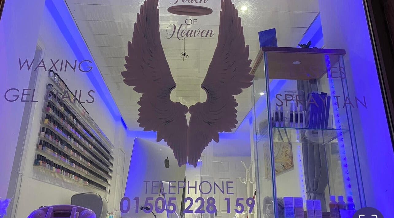 A Touch of Heaven beauty salon entrance showcasing treatments in Kilbirnie, Scotland, GB.