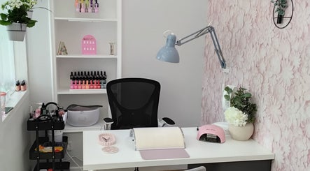 Chic nail salon setup at Luxe Lounge, Dingwall, Scotland, GB showcasing organized manicure tools and decor.