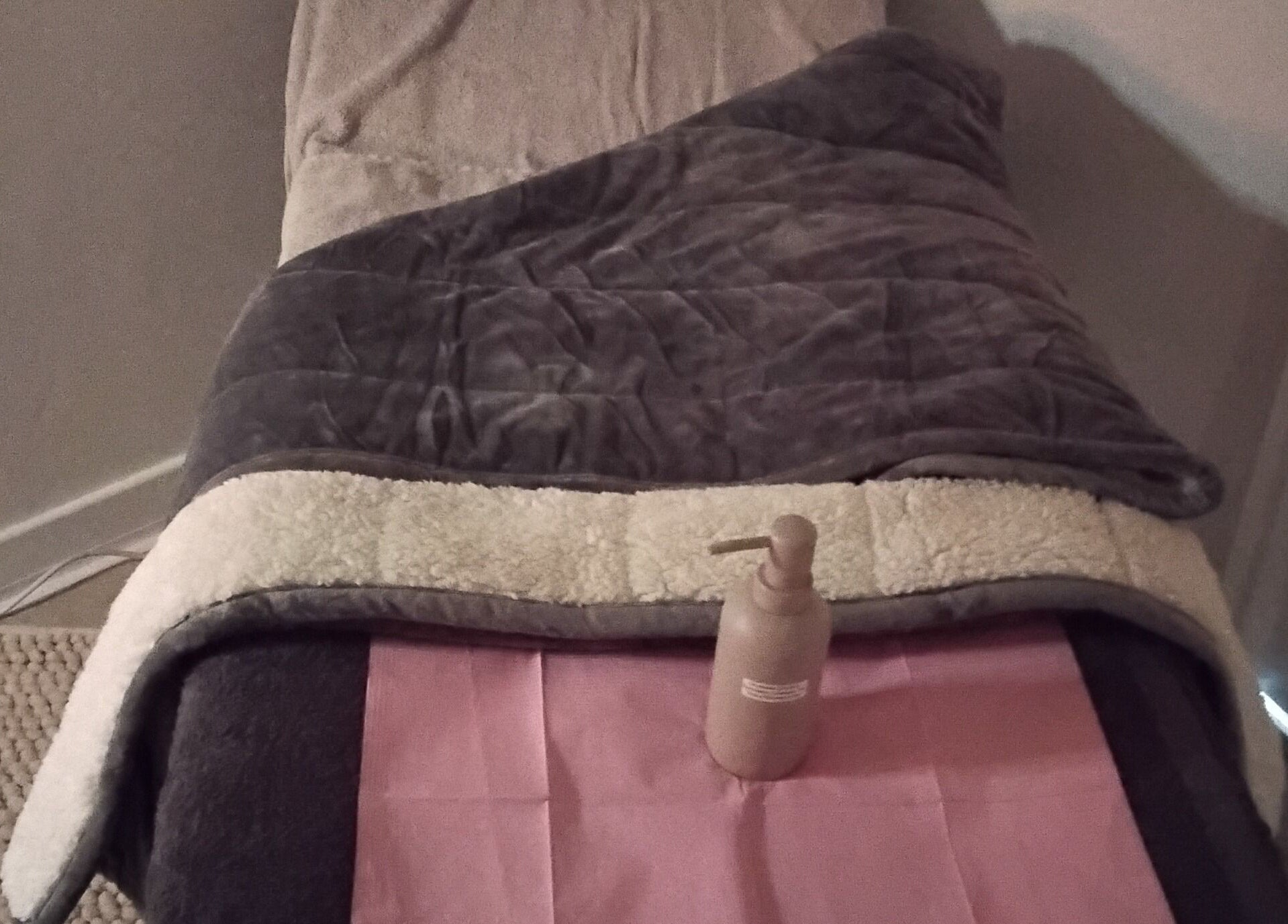 Plush massage bed at Luxe Lounge, Dingwall, Scotland, GB offering comfort and relaxation.