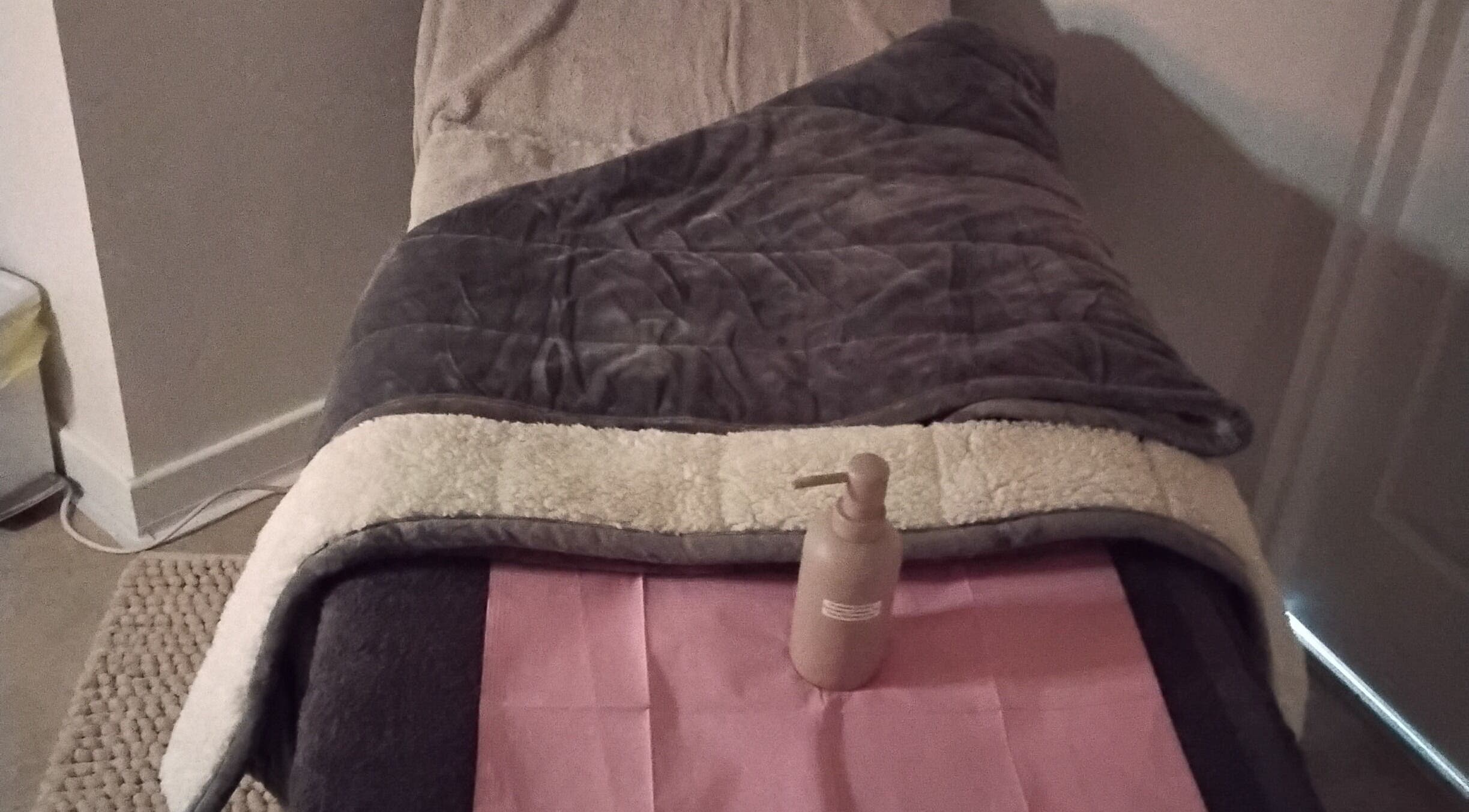 Plush massage bed at Luxe Lounge, Dingwall, Scotland, GB offering comfort and relaxation.