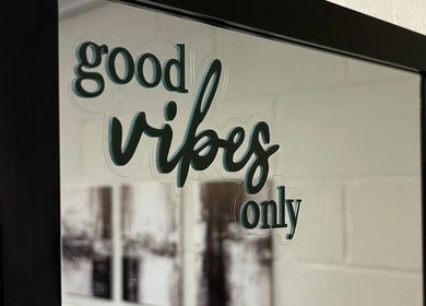 Mirror at A.J.Healing, South Ockendon, England, GB with 'good vibes only' text.
