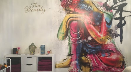 Colorful Buddha mural at True Beauty, Forfar, Scotland, GB with vibrant decor enhancing a peaceful ambiance.
