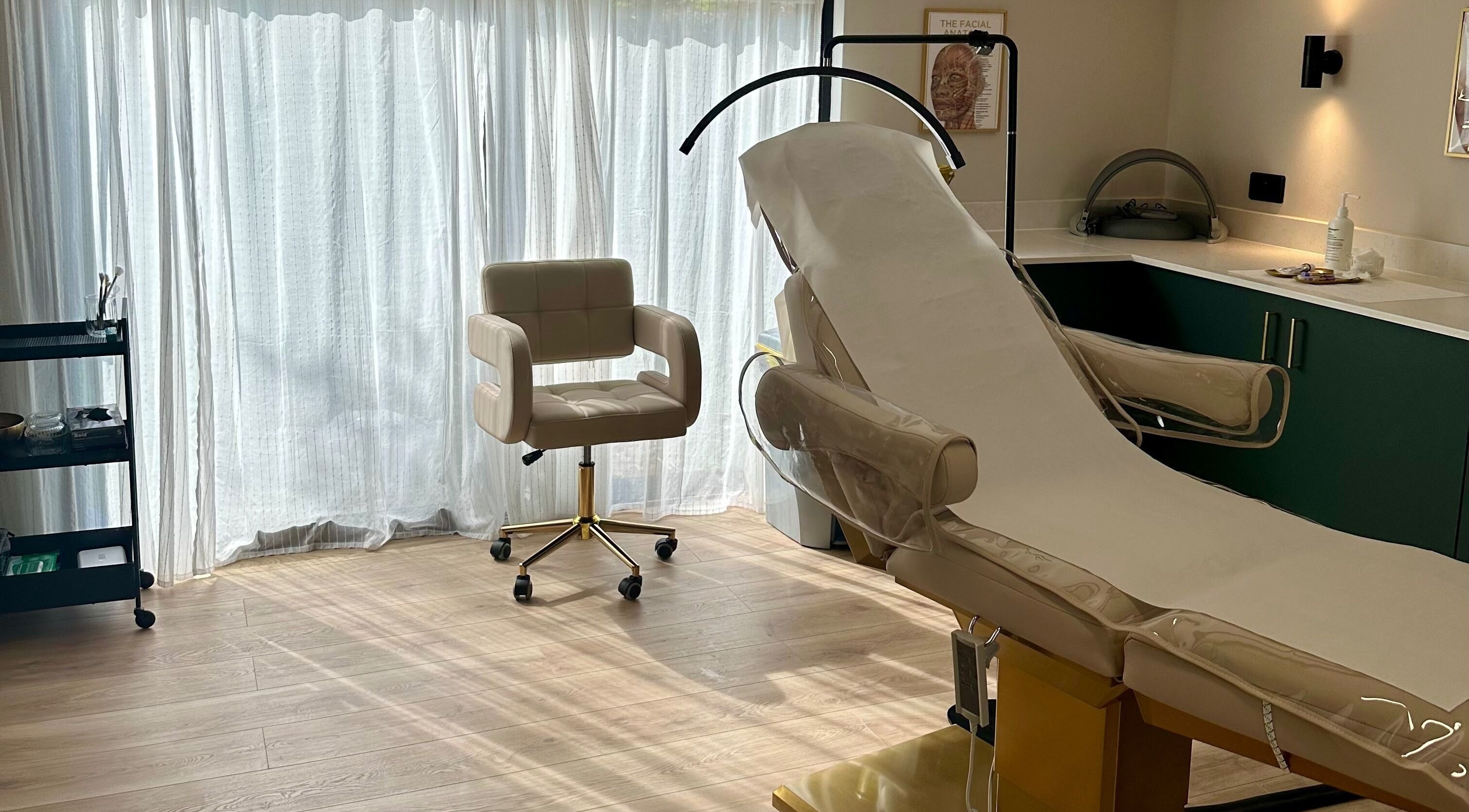 A bright treatment room at Skin Studios Chalkwell, Essex, GB with a comfy chair and modern equipment.