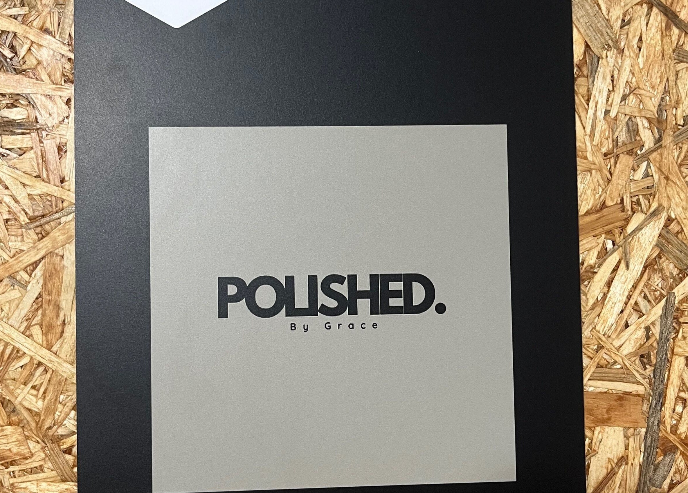 Signage of Polished by Grace in Barnsley, England, GB featuring elegant logo on wood and black panel background.