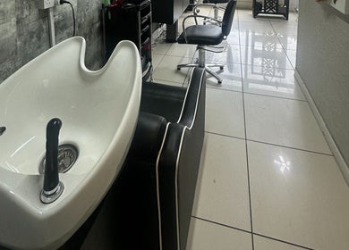 Modern wash station at Siin Hair Beauty in Nottingham, England, GB, with stylish salon chair.
