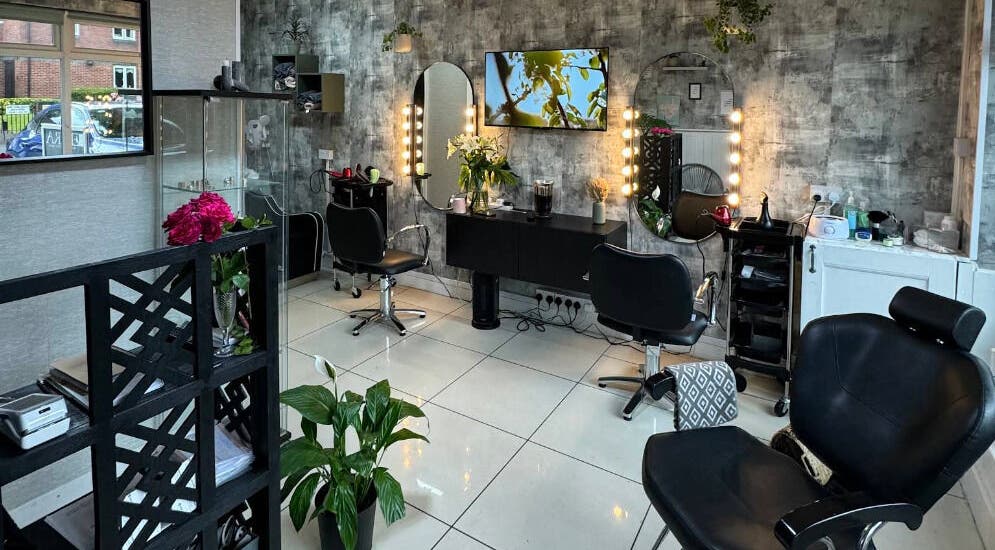 Elegant salon interior at Siin Hair Beauty, Nottingham, England, GB featuring stylish chairs and mirrors.