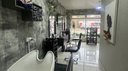 Chic interior of Siin Hair Beauty in Nottingham, England, GB, showcasing modern styling stations and decor.