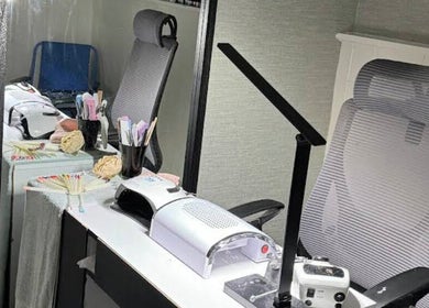 Nail station at Siin Hair Beauty in Nottingham, England, GB with tools and comfortable seating.