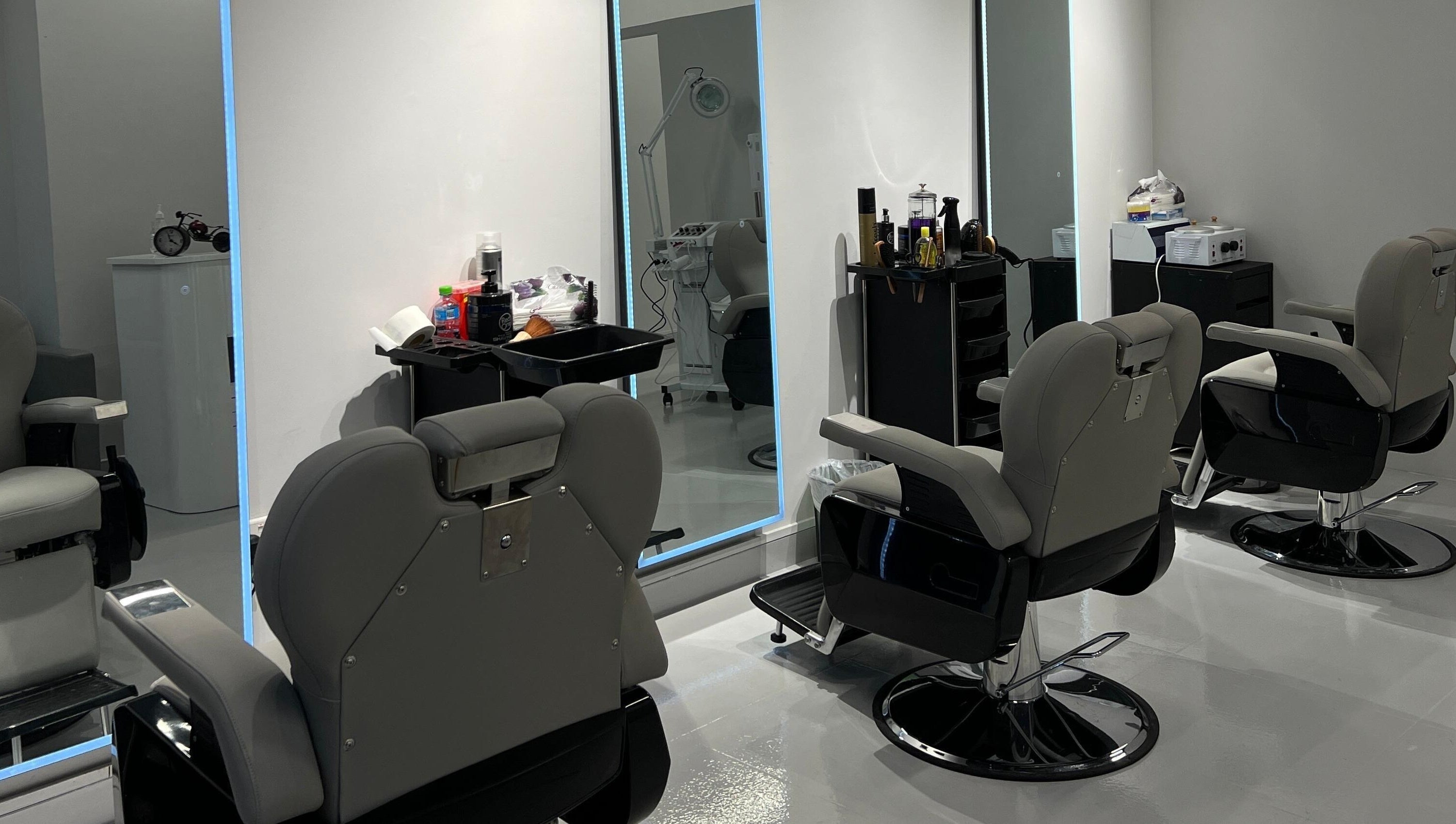 Modern barber chairs in sleek interior at The Barber Lab, Sharjah, Sharjah, AE.