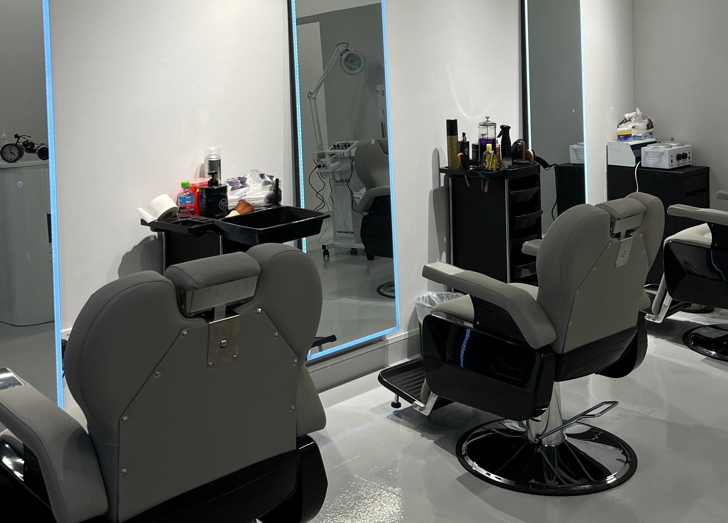 Modern barber chairs in sleek interior at The Barber Lab, Sharjah, Sharjah, AE.
