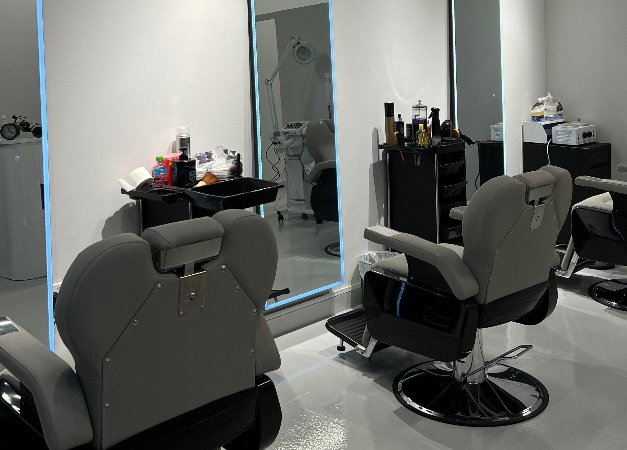 Modern barber chairs in sleek interior at The Barber Lab, Sharjah, Sharjah, AE.